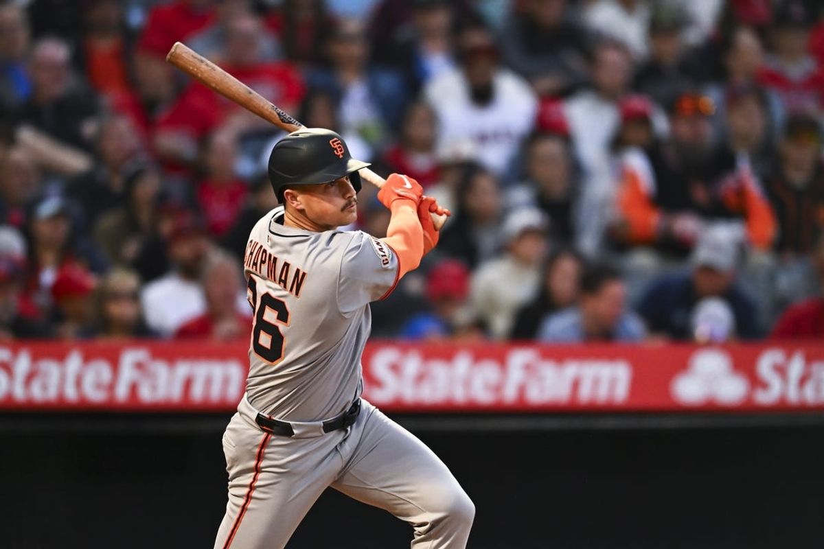 Apr 19, 2025; Anaheim, California, USA; San Francisco Giants third baseman Matt Chapman (26) singles against the Los Angeles Angels during the fourth inning at Angel Stadium. Mandatory Credit: Jonathan Hui-Imagn Images