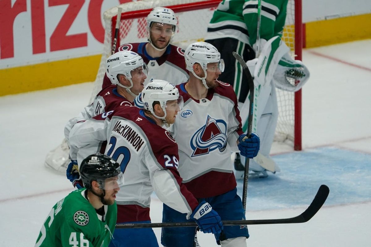 Apr 19, 2025; Dallas, Texas, USA; Colorado Avalanche center Nathan MacKinnon (29) celebrates his goal with teammates during the second period against the Dallas Stars in game one of the first round of the 2025 Stanley Cup Playoffs at American Airlines Center. Mandatory Credit: Raymond Carlin III-Imagn Images