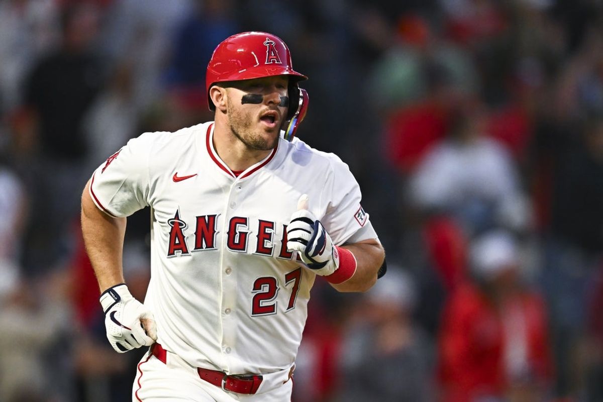 Apr 19, 2025; Anaheim, California, USA; Los Angeles Angels designated hitter Mike Trout (27) hits a one run home run against the San Francisco Giants during the fourth inning at Angel Stadium. Mandatory Credit: Jonathan Hui-Imagn Images