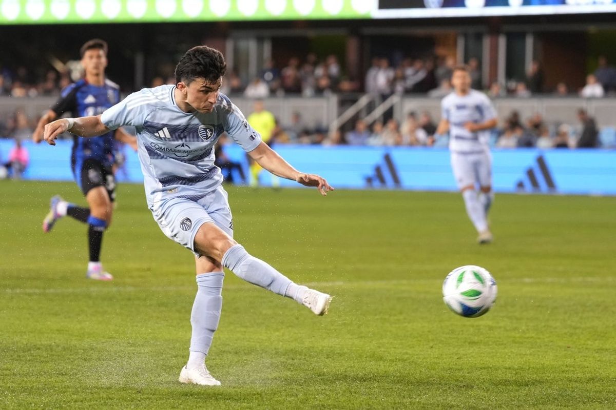 Apr 19, 2025; San Jose, California, USA; Sporting Kansas City midfielder Manu Garcia (21) scores a goal against the San Jose Earthquakes during the first half at PayPal Park. Mandatory Credit: Darren Yamashita-Imagn Images
