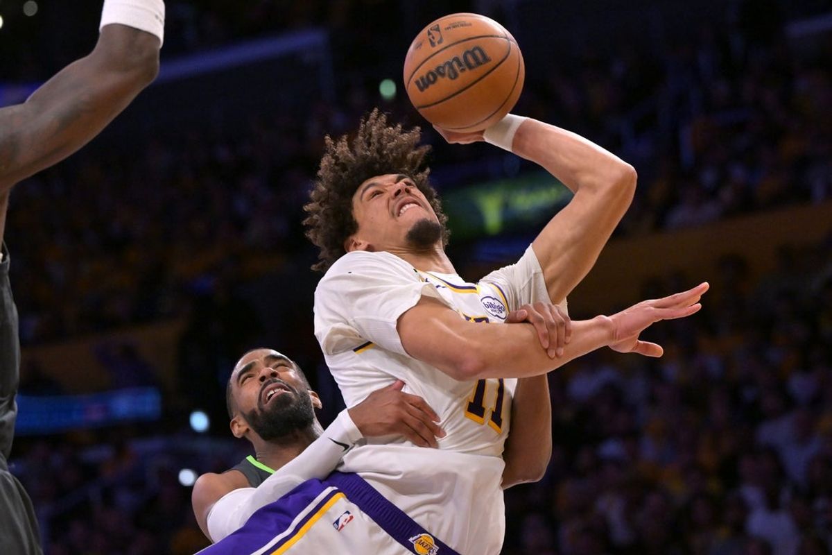 Apr 19, 2025; Los Angeles, California, USA; Los Angeles Lakers center Jaxson Hayes (11) is fouled by Minnesota Timberwolves guard Mike Conley (10) in the first half at Crypto.com Arena. Mandatory Credit: Jayne Kamin-Oncea-Imagn Images
