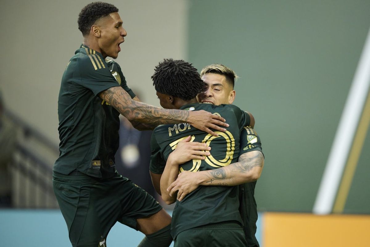 Apr 19, 2025; Portland, Oregon, USA; Portland Timbers forward Felipe Mora (9) celebrates scoring a goal on a penalty kick with teammates forward Antony (11) and midfielder Santiago Moreno (30) during the first half against Los Angeles FC at Providence Park. Mandatory Credit: Troy Wayrynen-Imagn Images