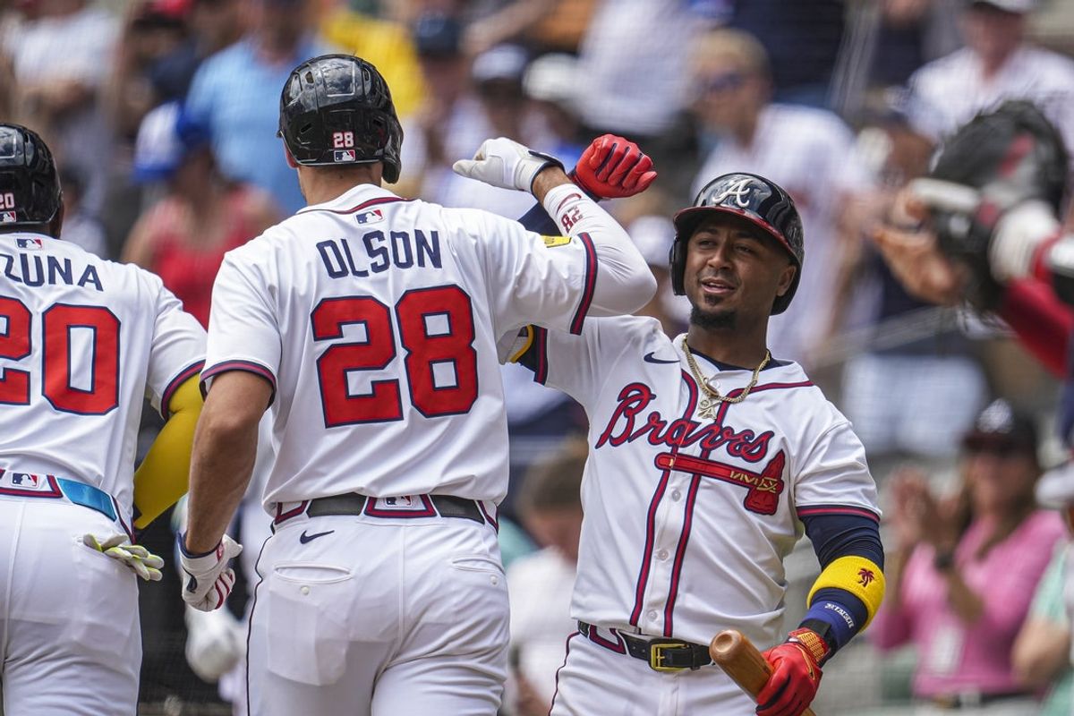 Apr 20, 2025; Cumberland, Georgia, USA; Atlanta Braves first baseman Matt Olson (28) reacts with second baseman Ozzie Albies (1)  after hitting a two run home run against the Minnesota Twins during the first inning at Truist Park. Mandatory Credit: Dale Zanine-Imagn Images
