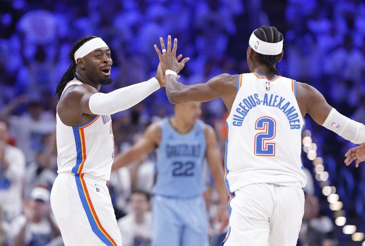 Apr 20, 2025; Oklahoma City, Oklahoma, USA; Oklahoma City Thunder guard Luguentz Dort (5) high fives guard Shai Gilgeous-Alexander (2) after scoring a three point basket against the Memphis Grizzlies during the second half at Paycom Center. Mandatory Credit: Alonzo Adams-Imagn Images