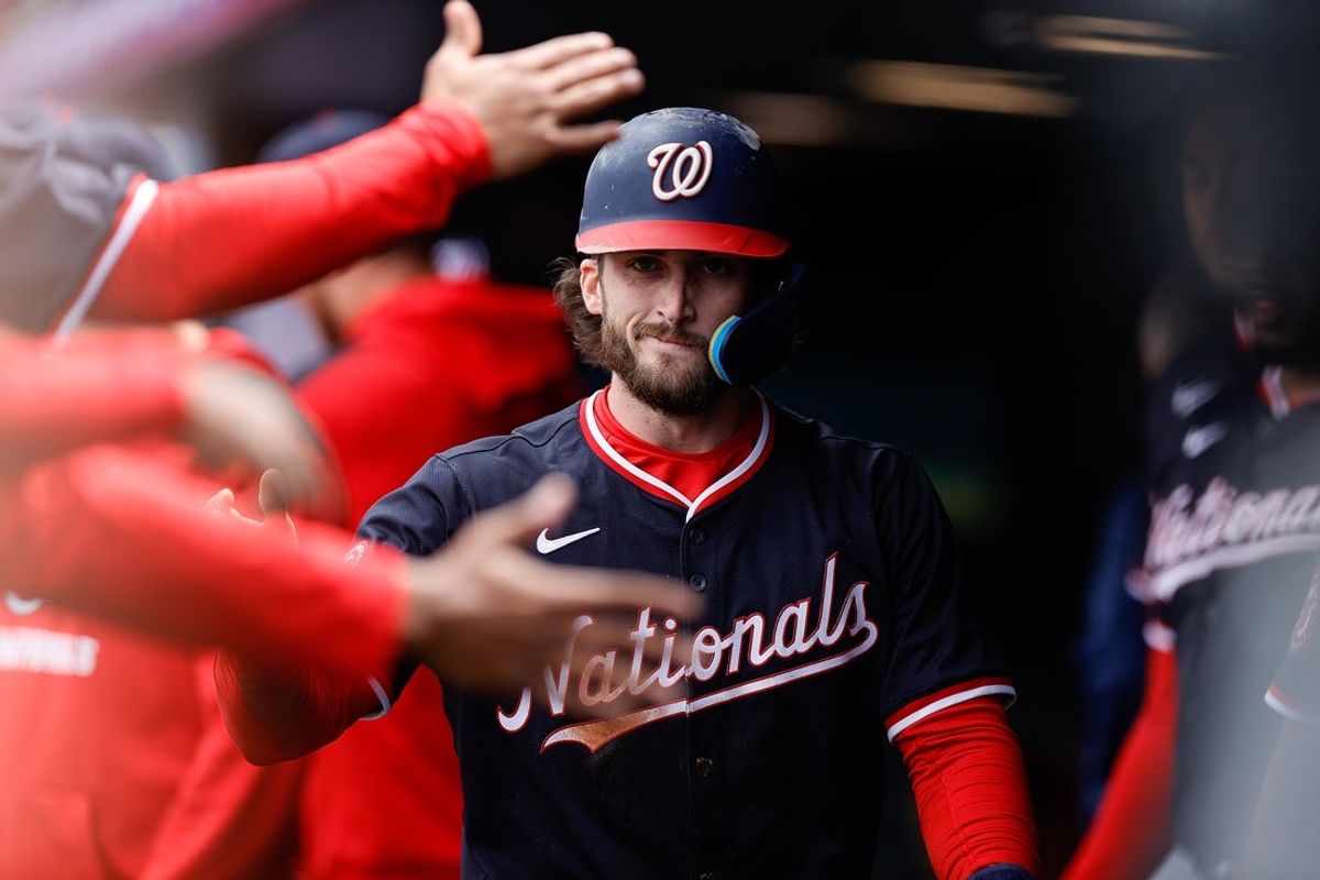 Apr 20, 2025; Denver, Colorado, USA; Washington Nationals right fielder Dylan Crews (3) celebrates in the dugout after scoring on a throwing error in the second inning against the Colorado Rockies at Coors Field. Mandatory Credit: Isaiah J. Downing-Imagn Images