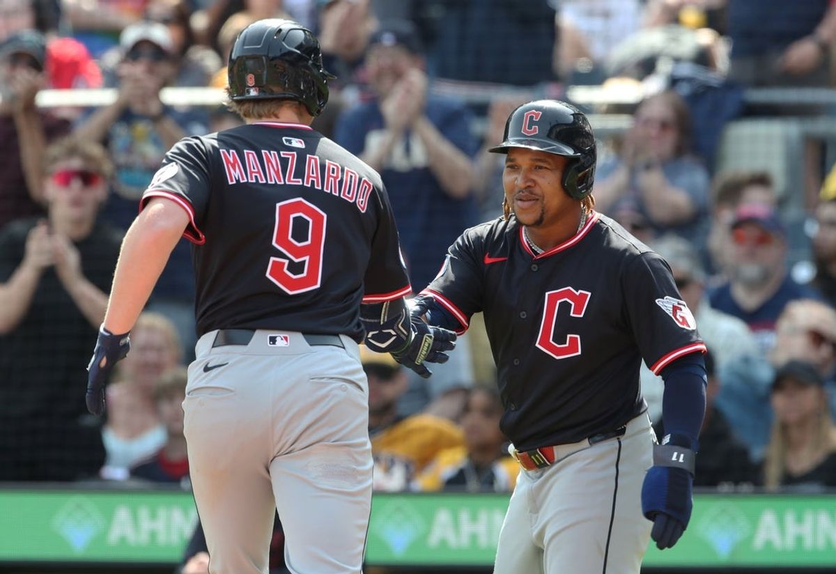 Apr 20, 2025; Pittsburgh, Pennsylvania, USA;  Cleveland Guardians third baseman Jose Ramirez (11) greets first baseman Kyle Manzardo (9) crossing home plate on a two run home run against the Pittsburgh Pirates during the seventh inning at PNC Park. Mandatory Credit: Charles LeClaire-Imagn Images