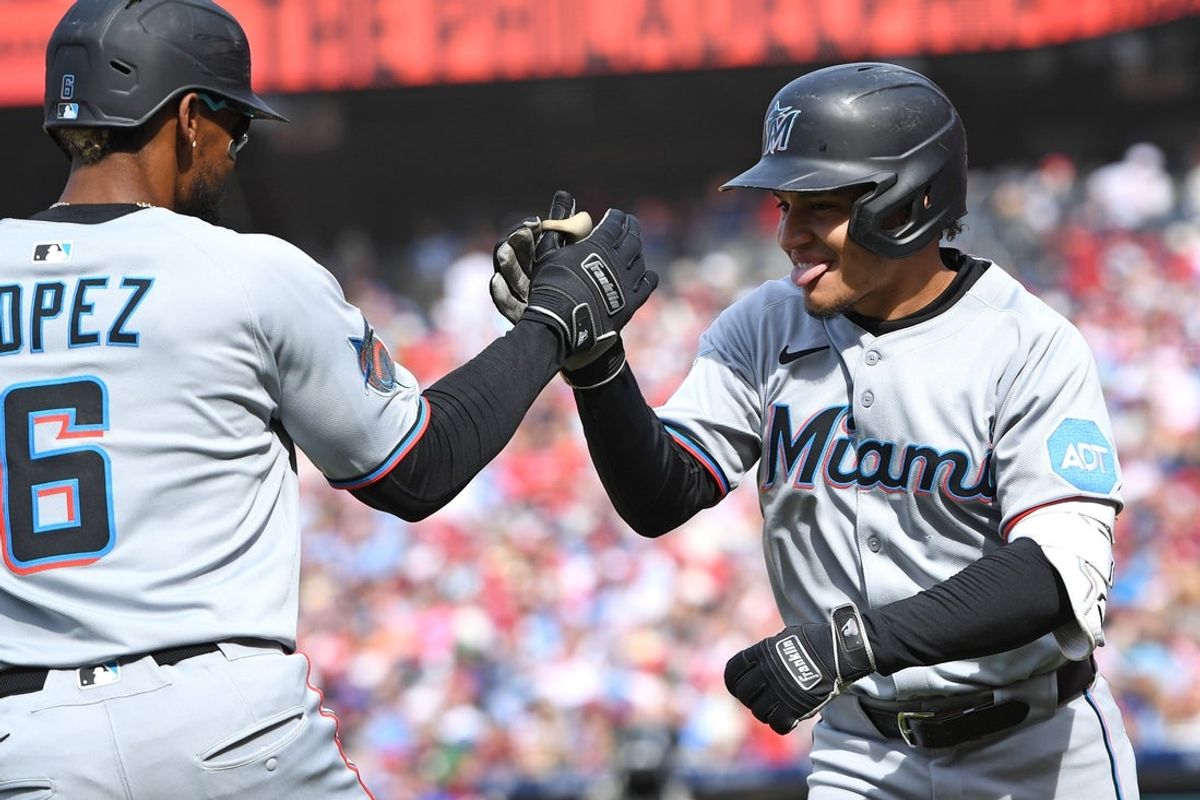 Apr 20, 2025; Philadelphia, Pennsylvania, USA; Miami Marlins outfielder Javier Sanoja (46) celebrates with second base Otto Lopez (6) after hitting a three-run home run during the eighth inning against the Philadelphia Phillies at Citizens Bank Park. Mandatory Credit: Eric Hartline-Imagn Images