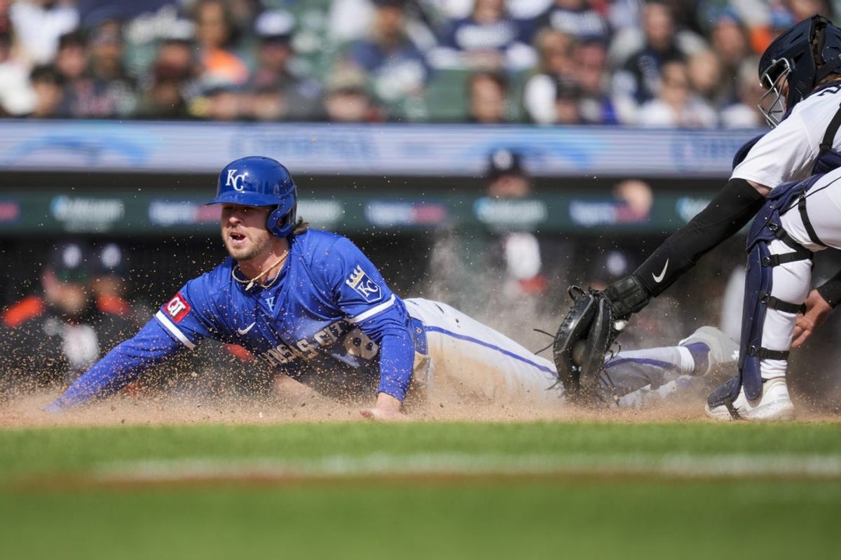 Apr 20, 2025; Detroit, Michigan, USA; Kansas City Royals outfielder Drew Waters (8) scores a run ahead of the tag by Detroit Tigers catcher Dillon Dingler (13) in the 10th inning at Comerica Park. Mandatory Credit: Aaron Doster-Imagn Images