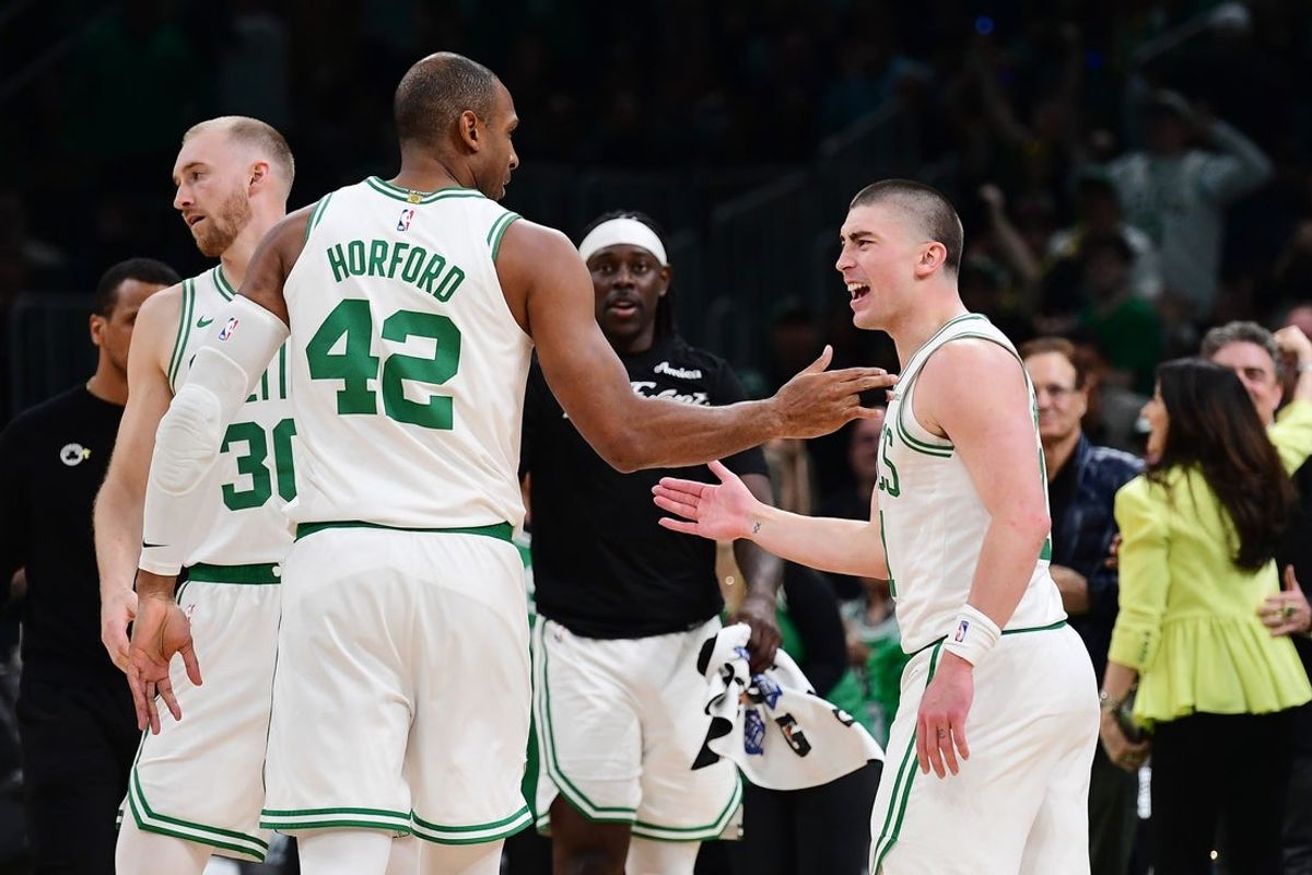 Apr 20, 2025; Boston, Massachusetts, USA; Boston Celtics guard Payton Pritchard (11) reacts with center Al Horford (42) after making a three point basket during the second half against the Orlando Magic at TD Garden. Mandatory Credit: Bob DeChiara-Imagn Images