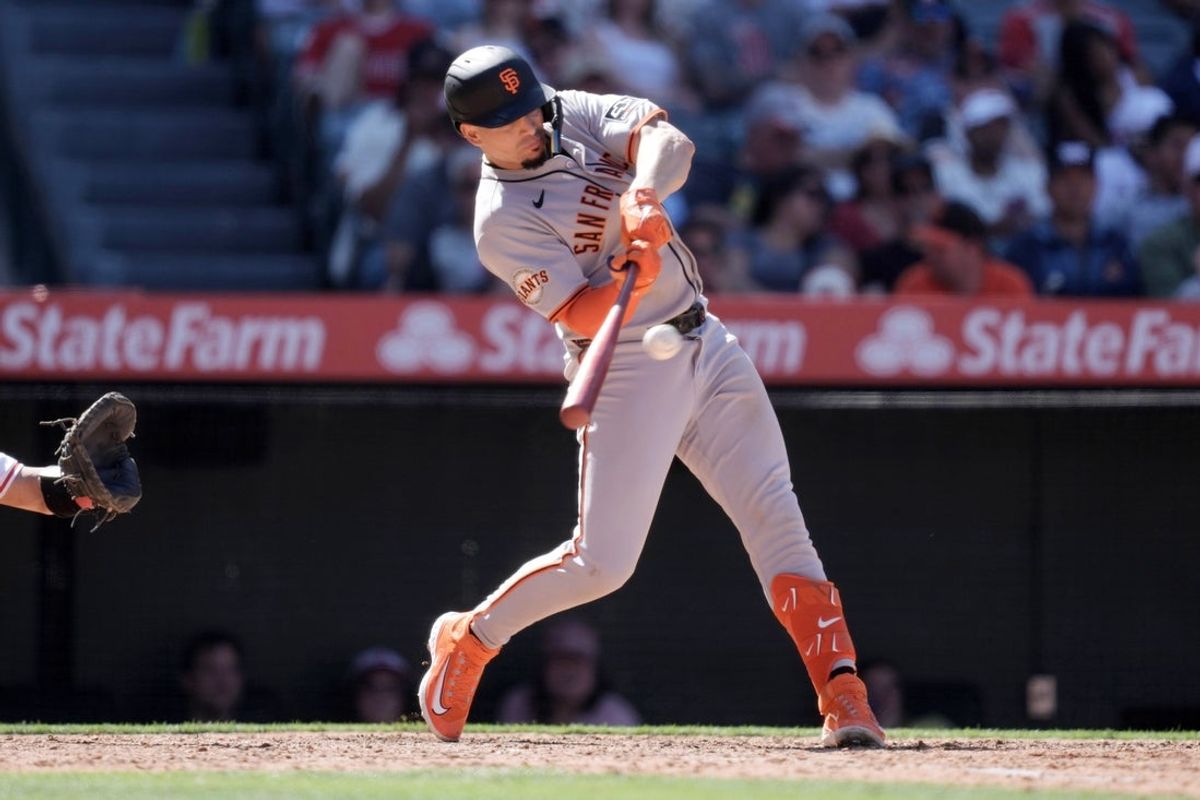 Apr 20, 2025; Anaheim, California, USA; San Francisco Giants shortstop Willy Adames (2) hits a RBI single in the eighth inning against the Los Angeles Angels at Angel Stadium. Mandatory Credit: Kirby Lee-Imagn Images