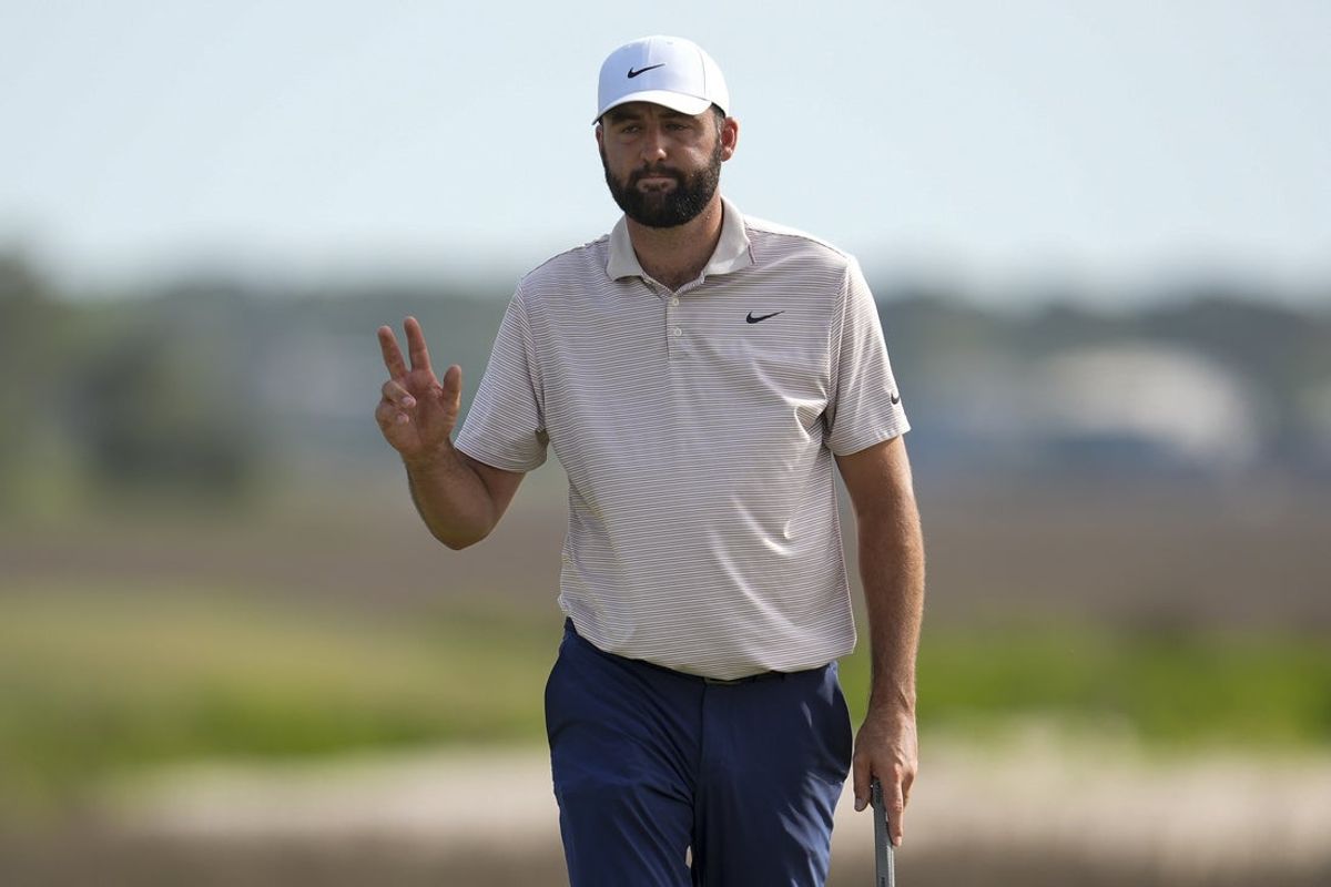 Apr 20, 2025; Hilton Head, South Carolina, USA; Scottie Scheffler acknowledges fans during the final round of the RBC Heritage golf tournament. Mandatory Credit: Jim Dedmon-Imagn Images