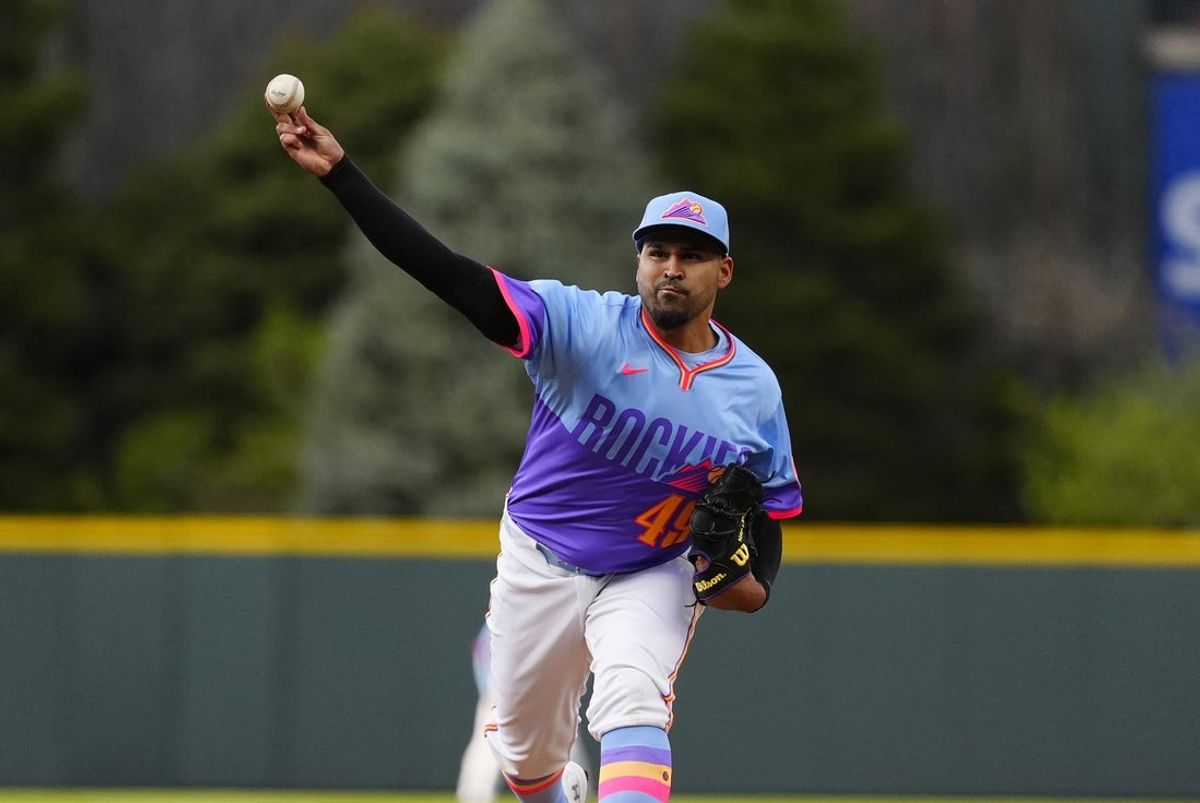 Apr 20, 2025; Denver, Colorado, USA; Colorado Rockies starting pitcher Antonio Senzatela (49) delivers a pitch in the first inning against the Washington Nationals at Coors Field. Mandatory Credit: Ron Chenoy-Imagn Images