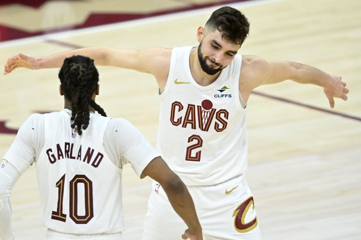 Apr 20, 2025; Cleveland, Ohio, USA; Cleveland Cavaliers guard Ty Jerome (2) and guard Darius Garland (10) celebrate in the fourth quarter against the Miami Heat at Rocket Arena. Mandatory Credit: David Richard-Imagn Images
