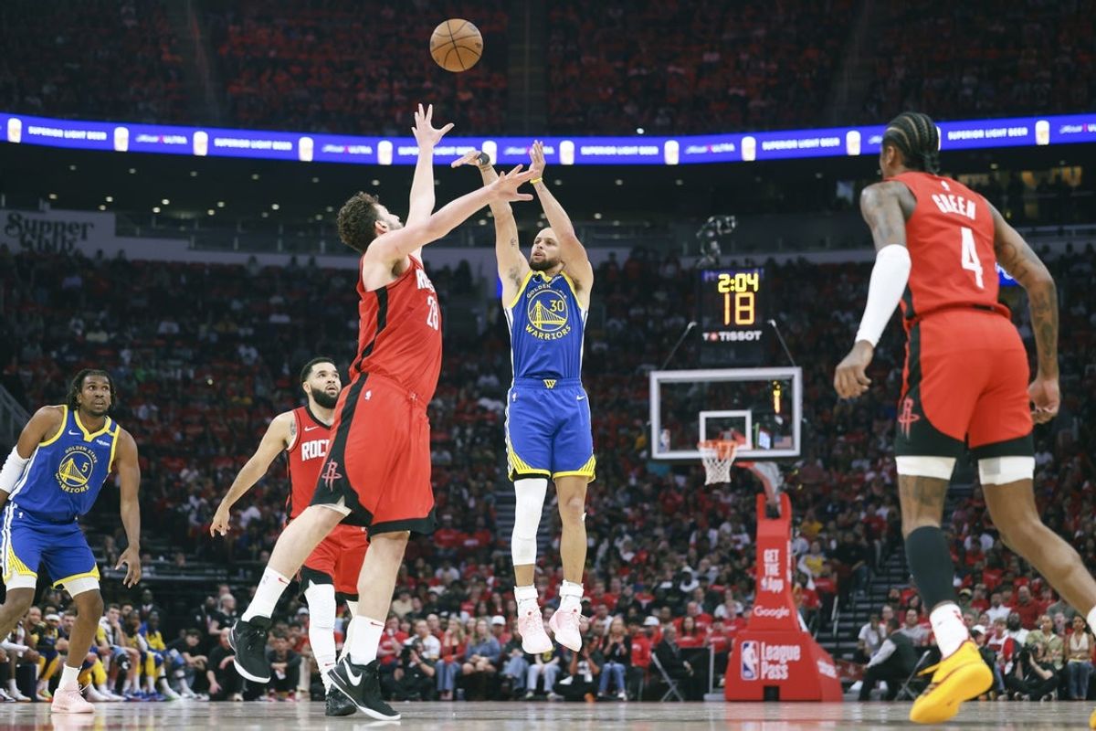 Apr 20, 2025; Houston, Texas, USA; Houston Rockets center Alperen Sengun (28) defends as Golden State Warriors guard Stephen Curry (30) shoots the ball during the second quarter at Toyota Center. Mandatory Credit: Troy Taormina-Imagn Images