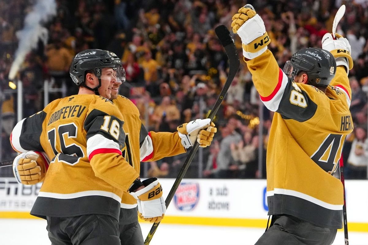 Apr 20, 2025; Las Vegas, Nevada, USA; Vegas Golden Knights left wing Pavel Dorofeyev (16) celebrates with Vegas Golden Knights defenseman Shea Theodore (27) and Vegas Golden Knights center Tomas Hertl (48) after scoring a goal against the Minnesota Wild during the second period of game one of the first round of the 2025 Stanley Cup Playoffs at T-Mobile Arena. Mandatory Credit: Stephen R. Sylvanie-Imagn Images