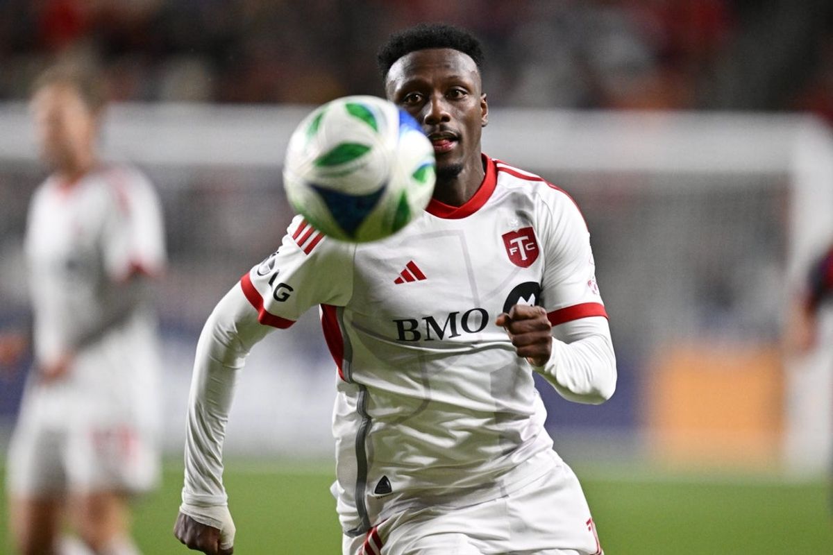 Apr 19, 2025; Sandy, Utah, USA;  Toronto FC midfielder Derrick Etienne Jr. (11) in action against Real Salt Lake at America First Field. Mandatory Credit: Jamie Sabau-Imagn Images
