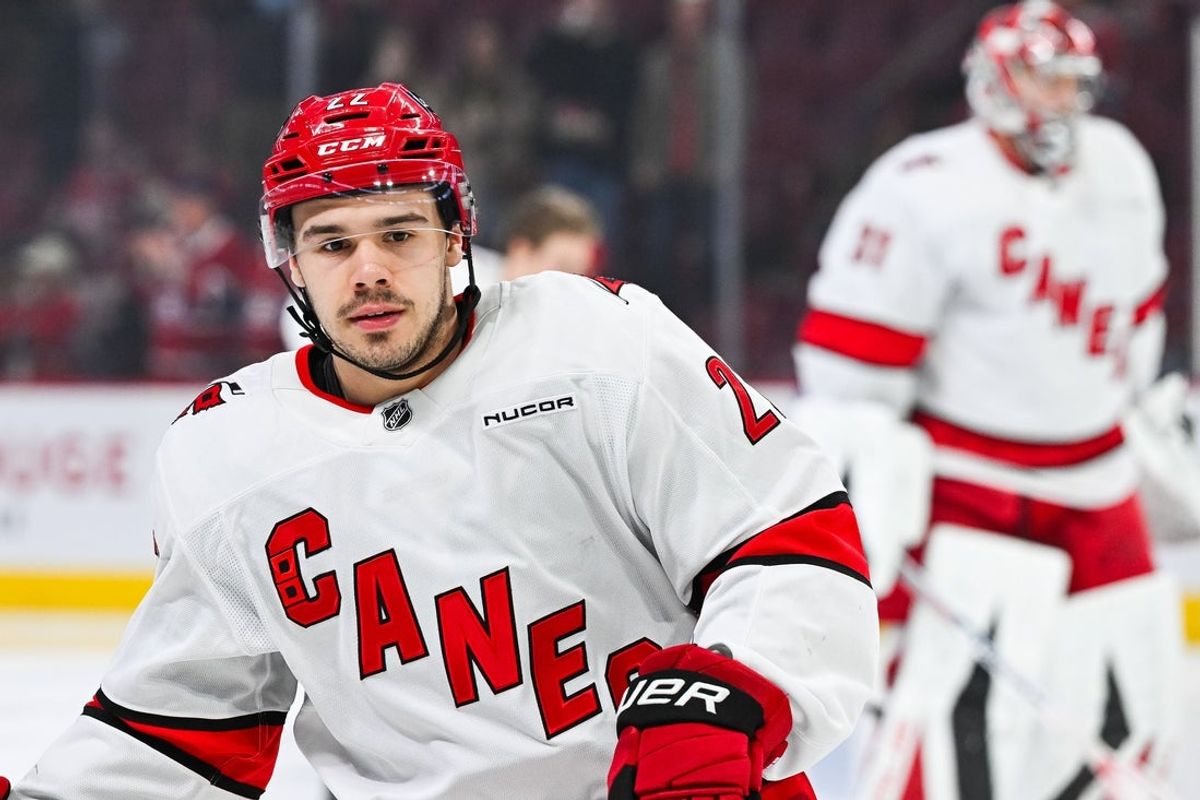 Apr 16, 2025; Montreal, Quebec, CAN; Carolina Hurricanes center Logan Stankoven (22) looks on in warm-up before the game against the Montreal Canadiens at Bell Centre. Mandatory Credit: David Kirouac-Imagn Images
