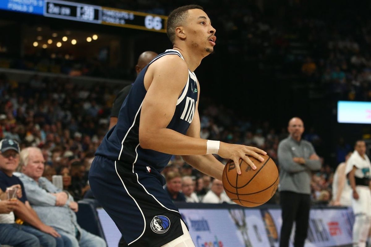 Apr 18, 2025; Memphis, Tennessee, USA; Dallas Mavericks guard Dante Exum (0) shoots for three during the second quarter against the Memphis Grizzlies at FedExForum. Mandatory Credit: Petre Thomas-Imagn Images