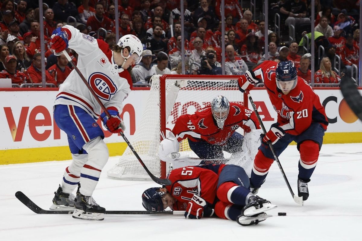 Apr 21, 2025; Washington, District of Columbia, USA;Washington Capitals defenseman Trevor van Riemsdyk (57) blocks a shot in front of Montreal Canadiens center Christian Dvorak (28), Washington Capitals center Lars Eller (20) and Capitals goaltender Logan Thompson (48) in the second period in game one of the first round of the 2025 Stanley Cup Playoffs at Capital One Arena. Mandatory Credit: Geoff Burke-Imagn Images
