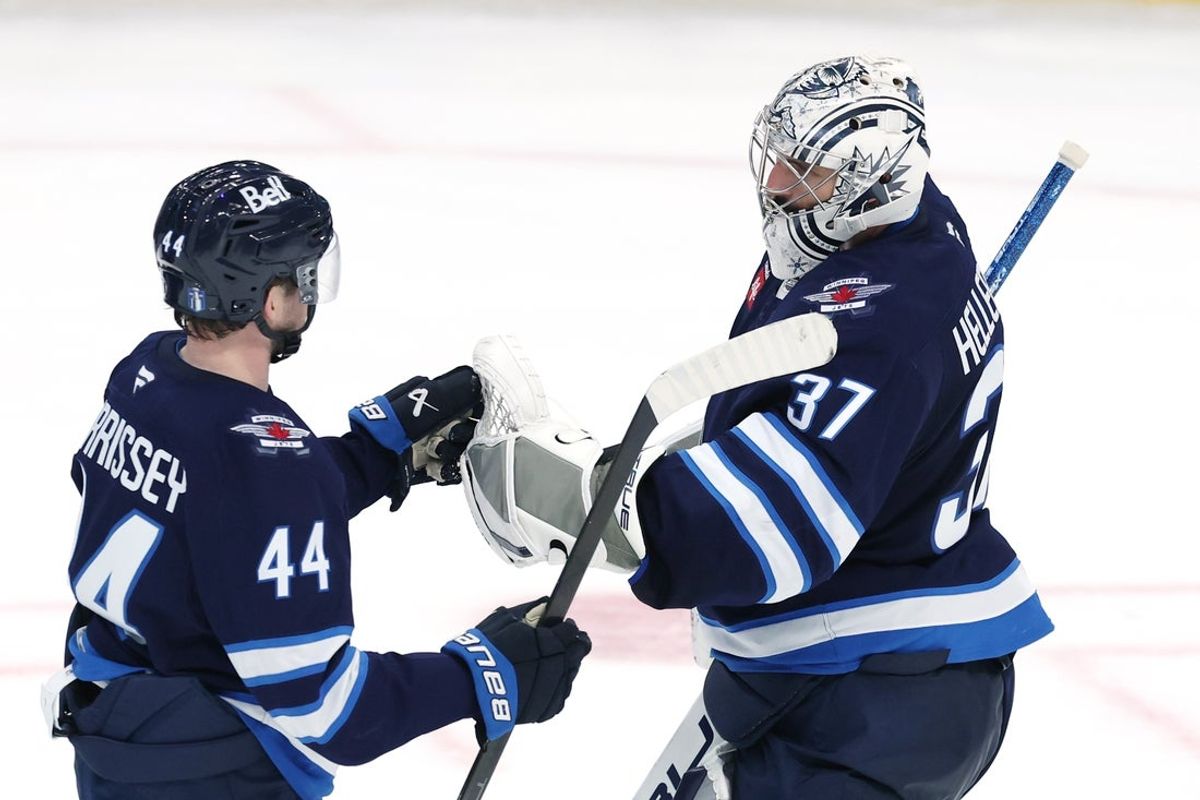 Apr 21, 2025; Winnipeg, Manitoba, CAN;Winnipeg Jets defenseman Josh Morrissey (44) and Winnipeg Jets goaltender Connor Hellebuyck (37) celebrate their victory against the St. Louis Blues in game two of the first round of the 2025 Stanley Cup Playoffs at Canada Life Centre. Mandatory Credit: James Carey Lauder-Imagn Images