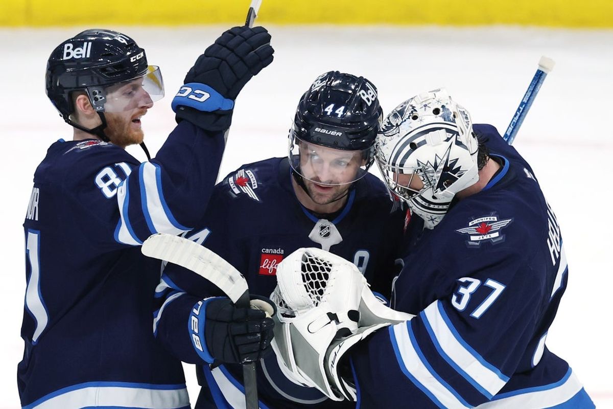 Apr 21, 2025; Winnipeg, Manitoba, CAN; Winnipeg Jets left wing Kyle Connor (81), Winnipeg Jets defenseman Josh Morrissey (44) and Winnipeg Jets goaltender Connor Hellebuyck (37) celebrate their victory against the St. Louis Blues in game two of the first round of the 2025 Stanley Cup Playoffs at Canada Life Centre. Mandatory Credit: James Carey Lauder-Imagn Images