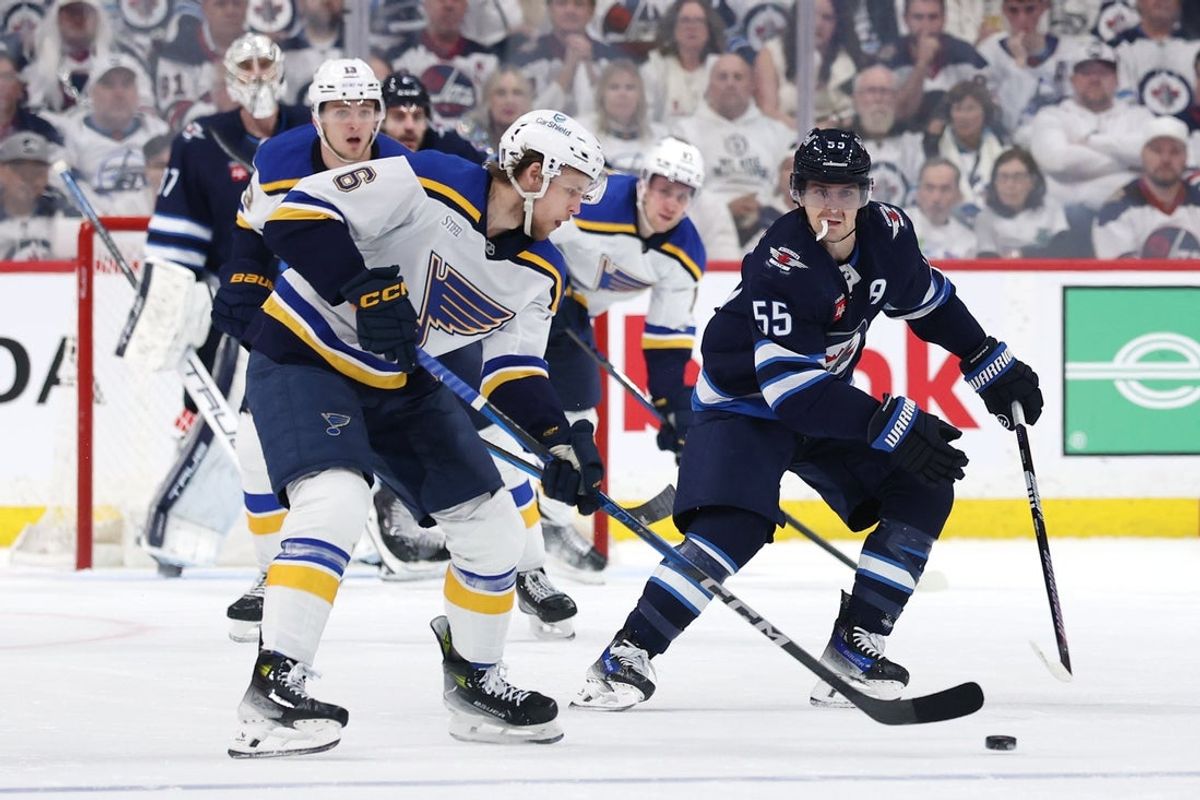 Apr 21, 2025; Winnipeg, Manitoba, CAN;Winnipeg Jets center Mark Scheifele (55) gets set to block shot by St. Louis Blues defenseman Philip Broberg (6) in the second period in game two of the first round of the 2025 Stanley Cup Playoffs at Canada Life Centre. Mandatory Credit: James Carey Lauder-Imagn Images