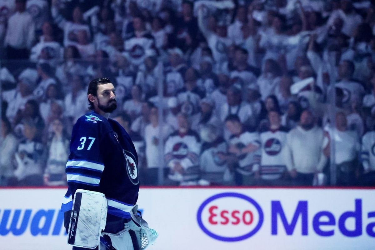 Apr 21, 2025; Winnipeg, Manitoba, CAN; Winnipeg Jets goaltender Connor Hellebuyck (37) looks on during the national anthems before a game against the St. Louis Blues in game two of the first round of the 2025 Stanley Cup Playoffs at Canada Life Centre. Mandatory Credit: James Carey Lauder-Imagn Images