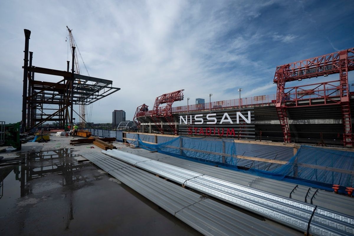 Construction continues on the new Nissan Stadium, future home of the Tennessee Titans, at Nissan Stadium in Nashville, Tenn., Tuesday, April 22, 2025. The area behind the blue screen will be an outdoor terrace.