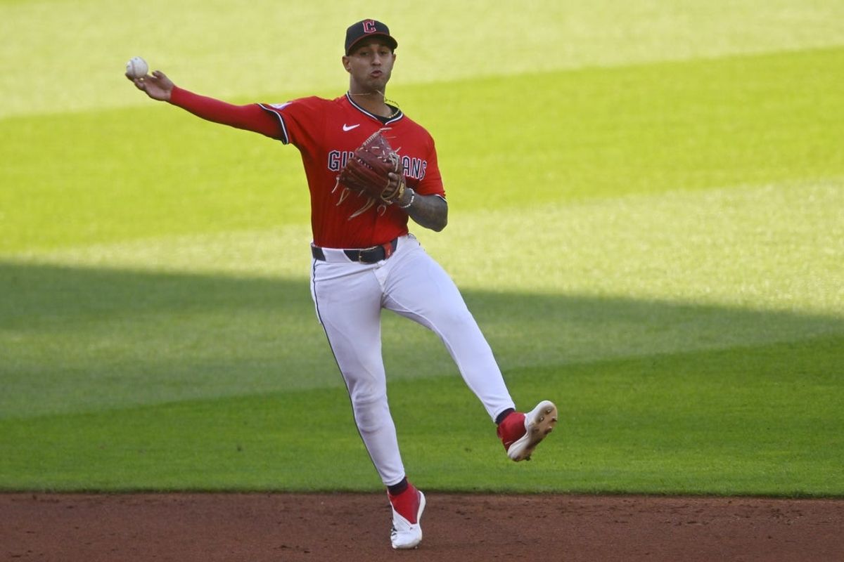 Apr 22, 2025; Cleveland, Ohio, USA; Cleveland Guardians shortstop Brayan Rocchio (4) throws to first base in the third inning against the New York Yankees at Progressive Field. Mandatory Credit: David Richard-Imagn Images