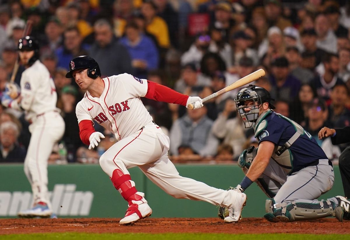 Apr 22, 2025; Boston, Massachusetts, USA; Boston Red Sox third base Alex Bregman (2) hits a double to drive in a run against the Seattle Mariners in the third inning at Fenway Park. Mandatory Credit: David Butler II-Imagn Images