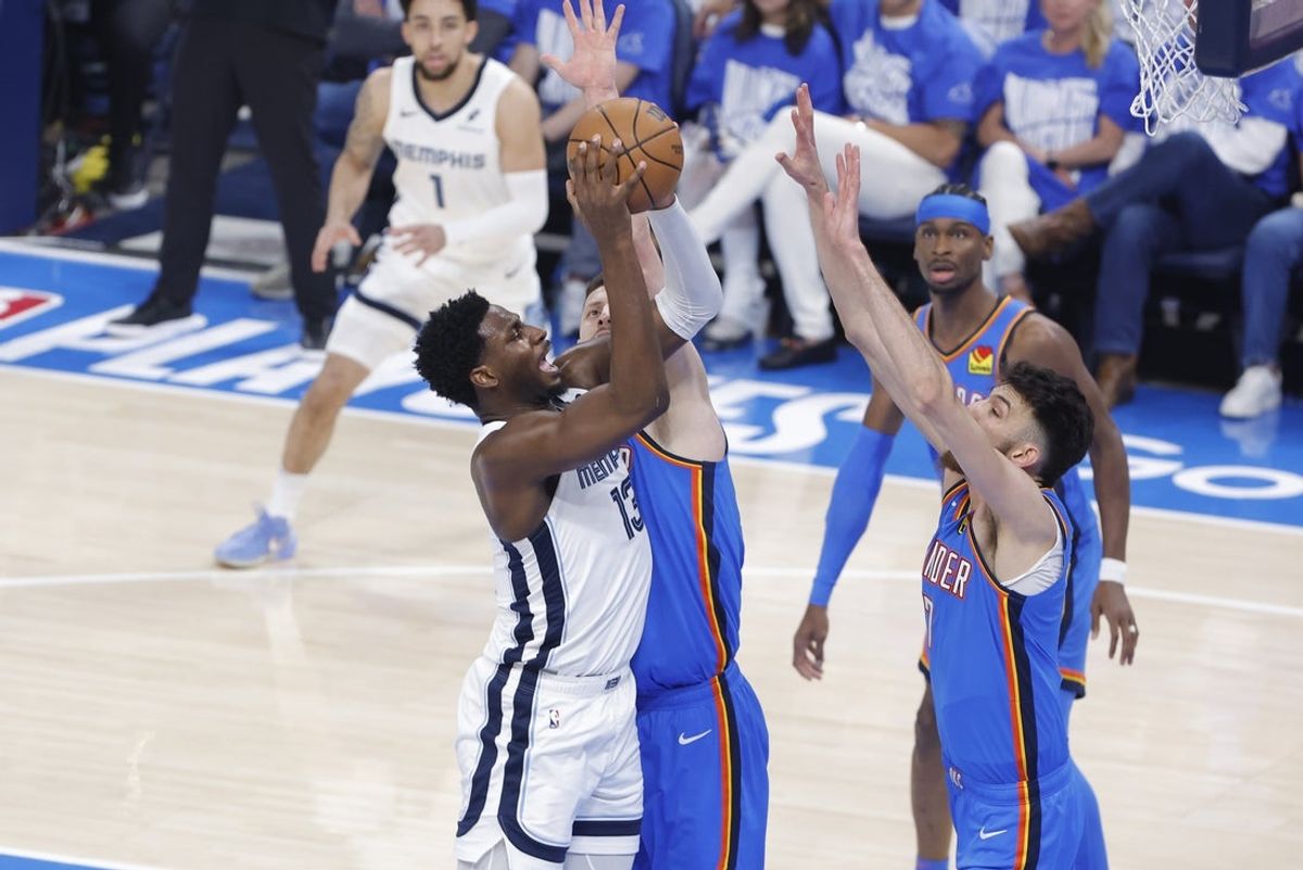 Apr 22, 2025; Oklahoma City, Oklahoma, USA; Memphis Grizzlies forward Jaren Jackson Jr. (13) shoots as Oklahoma City Thunder center Isaiah Hartenstein (55) and forward Chet Holmgren (7) defend the shot in the first quarter during game two of first round for the 2024 NBA Playoffs at Paycom Center. Mandatory Credit: Alonzo Adams-Imagn Images