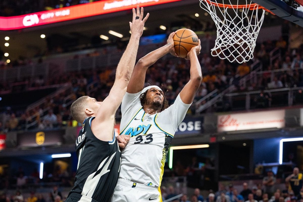 Apr 22, 2025; Indianapolis, Indiana, USA; Indiana Pacers center Myles Turner (33) shoots the ball while Milwaukee Bucks center Brook Lopez (11) defends during game two of first round for the 2024 NBA Playoffs at Gainbridge Fieldhouse. Mandatory Credit: Trevor Ruszkowski-Imagn Images