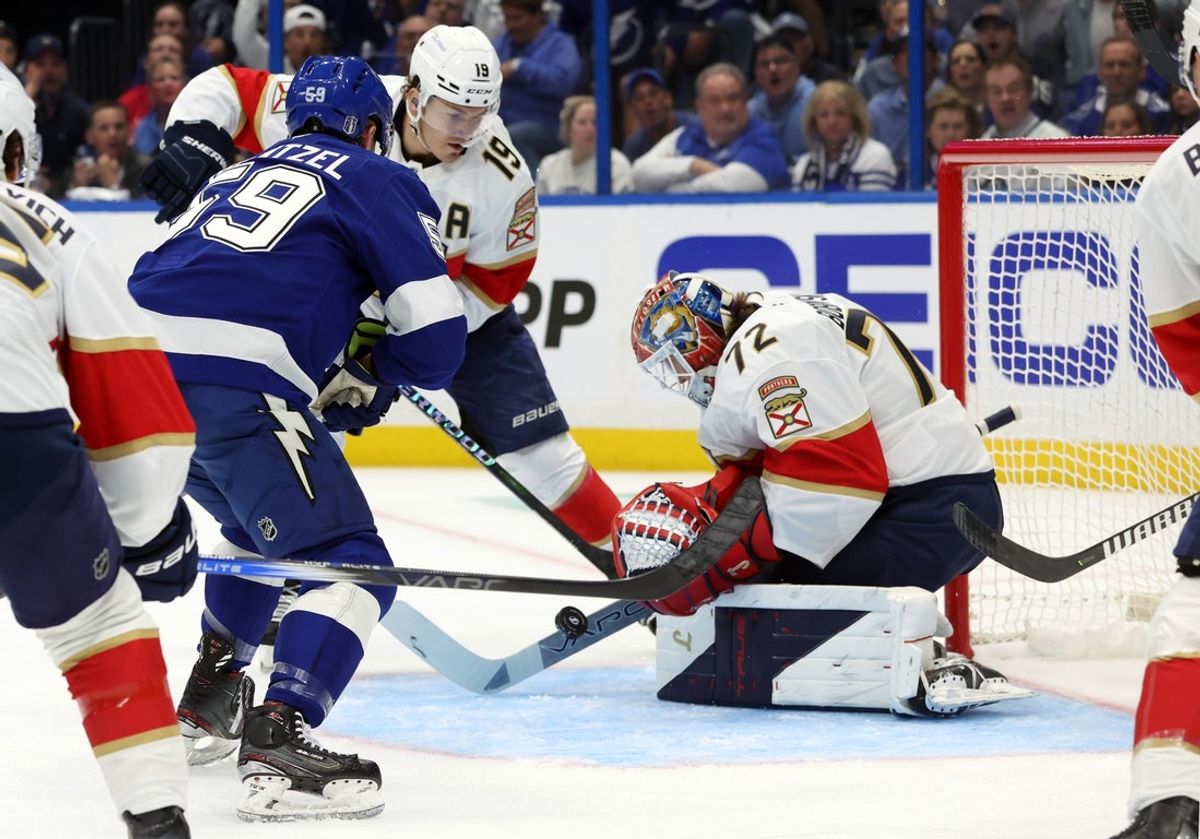 Apr 22, 2025; Tampa, Florida, USA; Florida Panthers goaltender Sergei Bobrovsky (72) defends the puck from Tampa Bay Lightning center Jake Guentzel (59) during the first period in game one of the first round of the 2025 Stanley Cup Playoffs at Amalie Arena. Mandatory Credit: Kim Klement Neitzel-Imagn Images