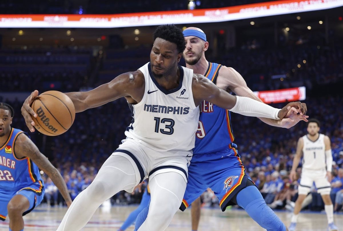 Apr 22, 2025; Oklahoma City, Oklahoma, USA; Memphis Grizzlies forward Jaren Jackson Jr. (13) moves the ball against Oklahoma City Thunder guard Alex Caruso (9) in the third quarter during game two of first round for the 2024 NBA Playoffs at Paycom Center. Mandatory Credit: Alonzo Adams-Imagn Images