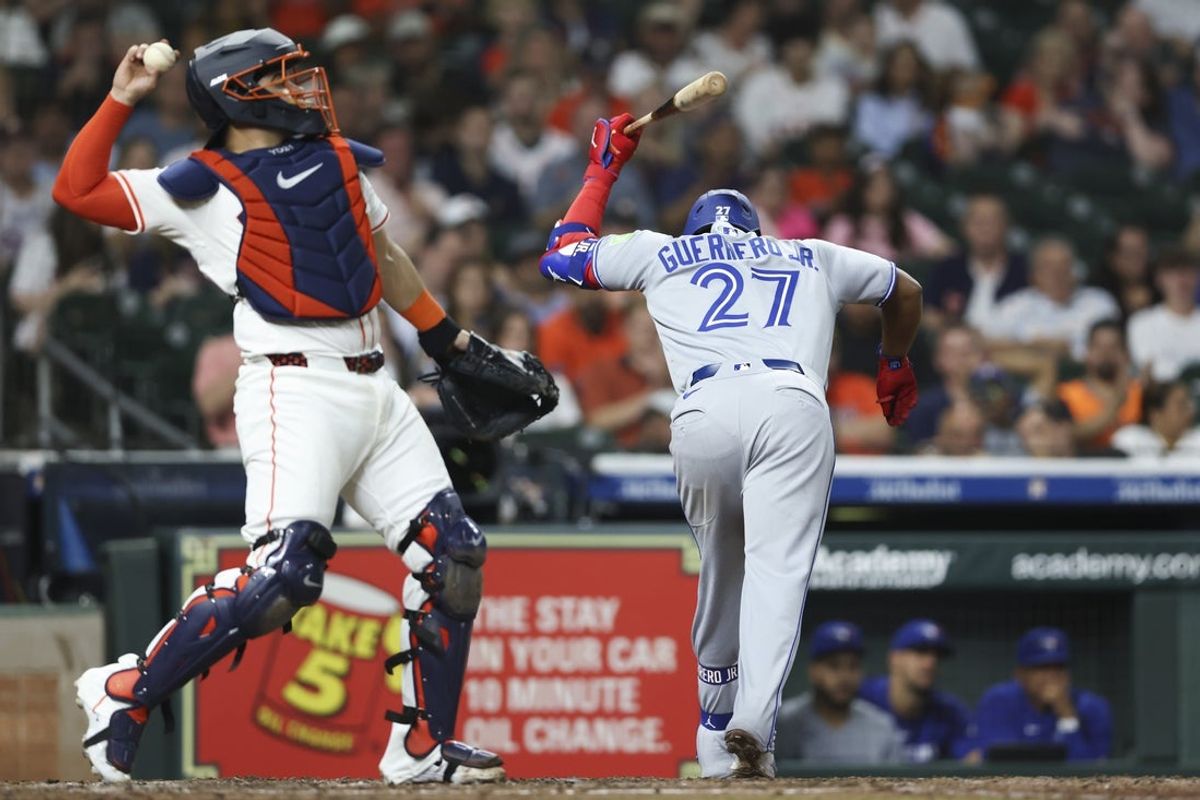 Apr 22, 2025; Houston, Texas, USA; Toronto Blue Jays designated hitter Vladimir Guerrero Jr. (27) slams his bat on the ground after striking out during the sixth inning against the Houston Astros at Daikin Park. Mandatory Credit: Troy Taormina-Imagn Images