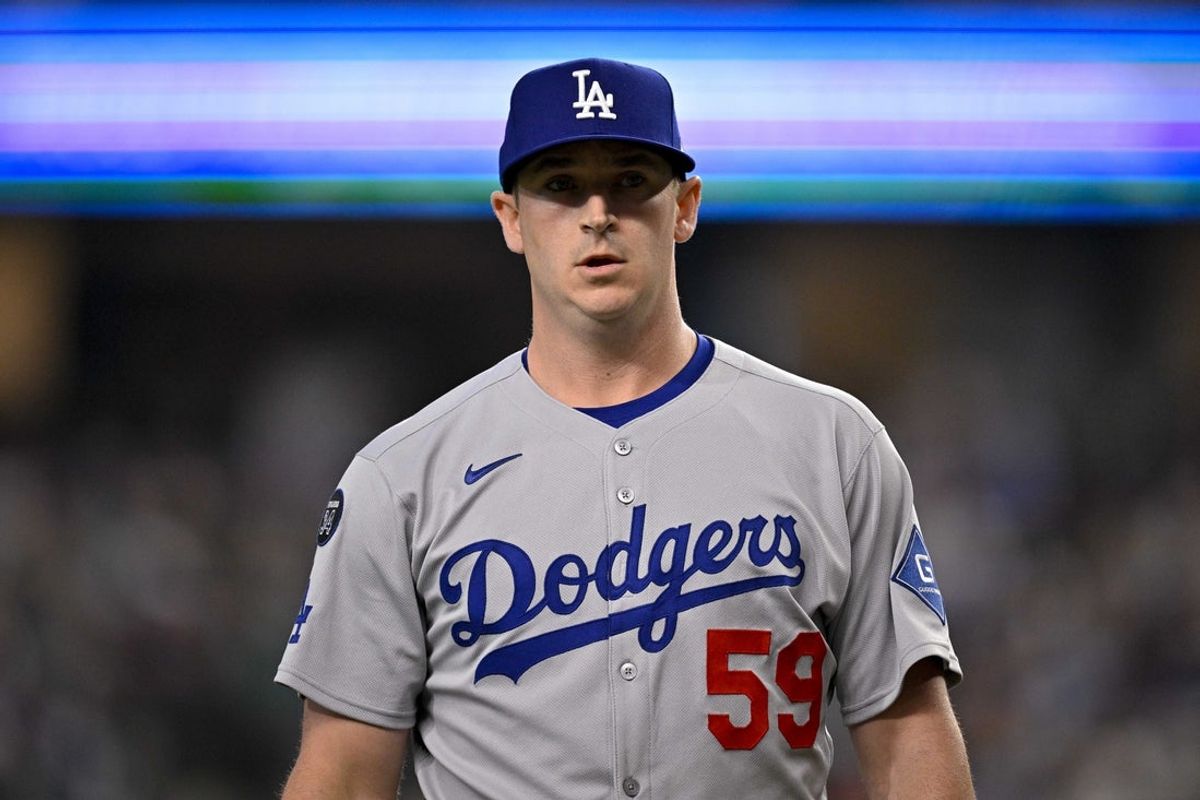 Apr 20, 2025; Arlington, Texas, USA; Los Angeles Dodgers relief pitcher Evan Phillips (59) comes off the field during the game between the Texas Rangers and the Los Angeles Dodgers at Globe Life Field. Mandatory Credit: Jerome Miron-Imagn Images