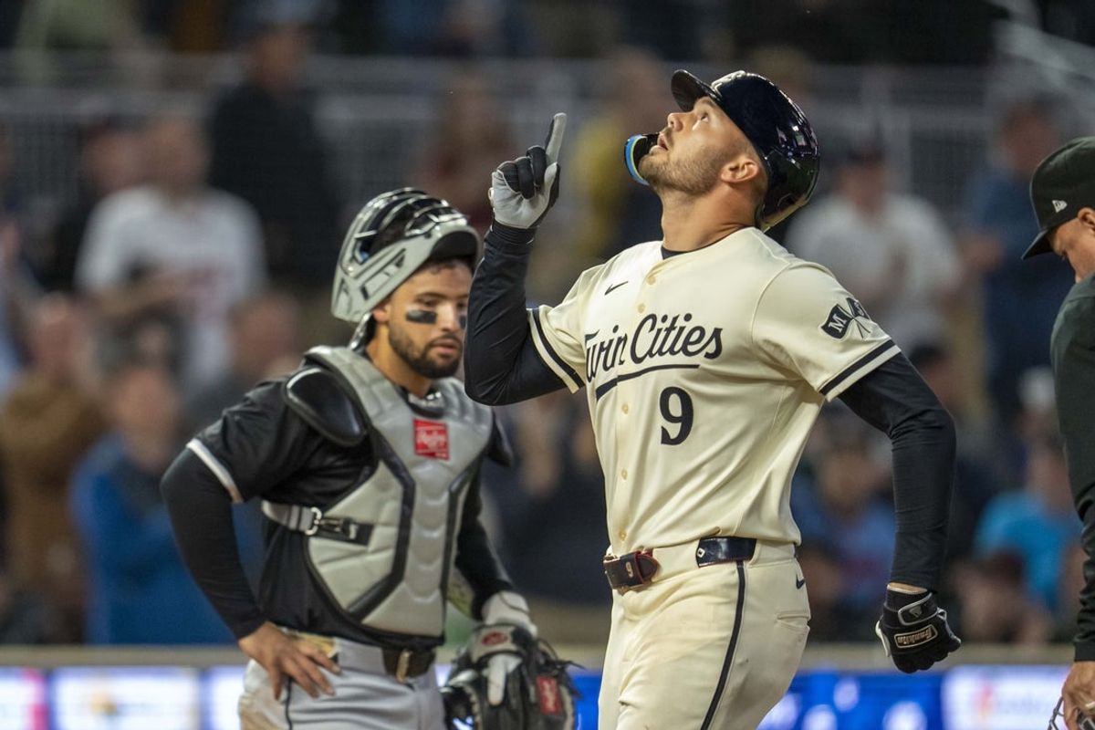 Apr 22, 2025; Minneapolis, Minnesota, USA; Minnesota Twins right fielder Trevor Larnach (9) celebrates hitting a two run home run against the Chicago White Sox in the eighth inning at Target Field. Mandatory Credit: Jesse Johnson-Imagn Images