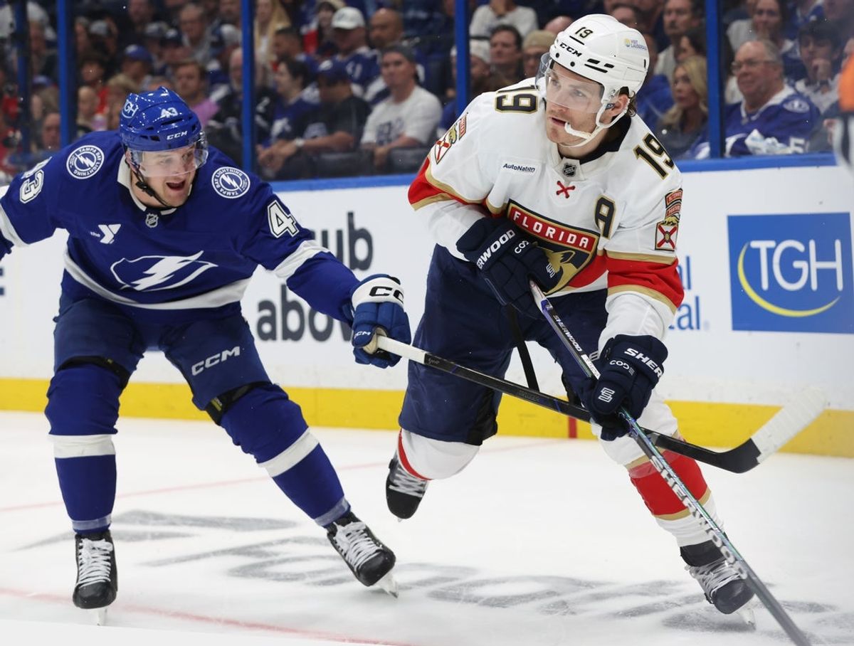 Apr 22, 2025; Tampa, Florida, USA; Florida Panthers left wing Matthew Tkachuk (19) skates with the puck as Tampa Bay Lightning defenseman Darren Raddysh (43) defends during the second period in game one of the first round of the 2025 Stanley Cup Playoffs at Amalie Arena. Mandatory Credit: Kim Klement Neitzel-Imagn Images