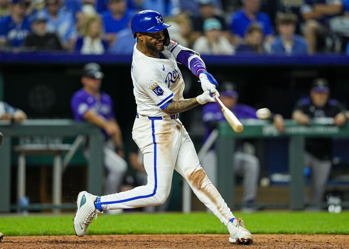 Apr 22, 2025; Kansas City, Missouri, USA; Kansas City Royals third baseman Maikel Garcia (11) hits a double during the ninth inning against the Colorado Rockies at Kauffman Stadium. Mandatory Credit: Jay Biggerstaff-Imagn Images