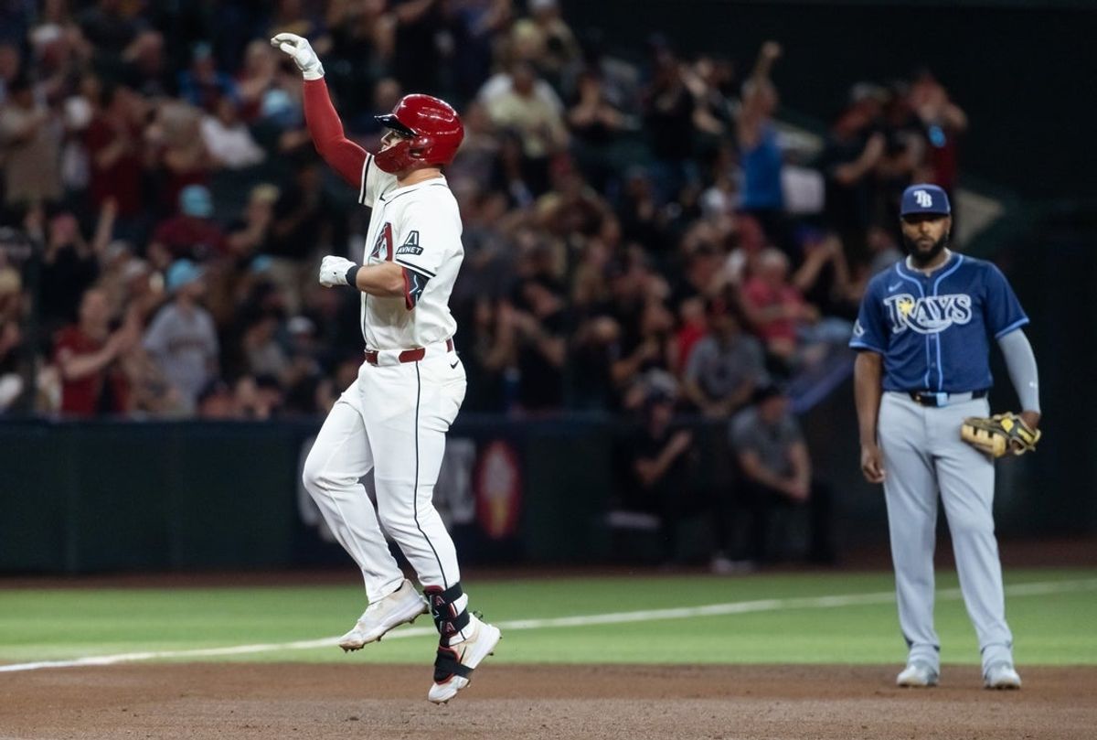 Apr 22, 2025; Phoenix, Arizona, USA; Tampa Bay Rays infielder Tim Tawa celebrates as he rounds the bases after hitting a solo home run in the fifth inning against the Arizona Diamondbacks at Chase Field. Mandatory Credit: Mark J. Rebilas-Imagn Images