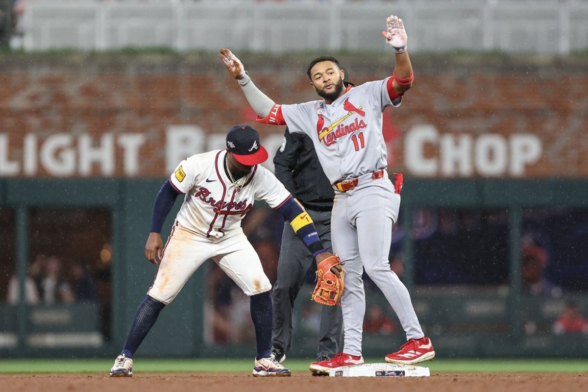 Apr 22, 2025; Cumberland, Georgia, USA; St. Louis Cardinals outfielder Victor Scott II (11) celebrates while safe at second against Atlanta Braves second base Ozzie Albies (1) during the ninth  inning at Truist Park. Mandatory Credit: Jordan Godfree-Imagn Images