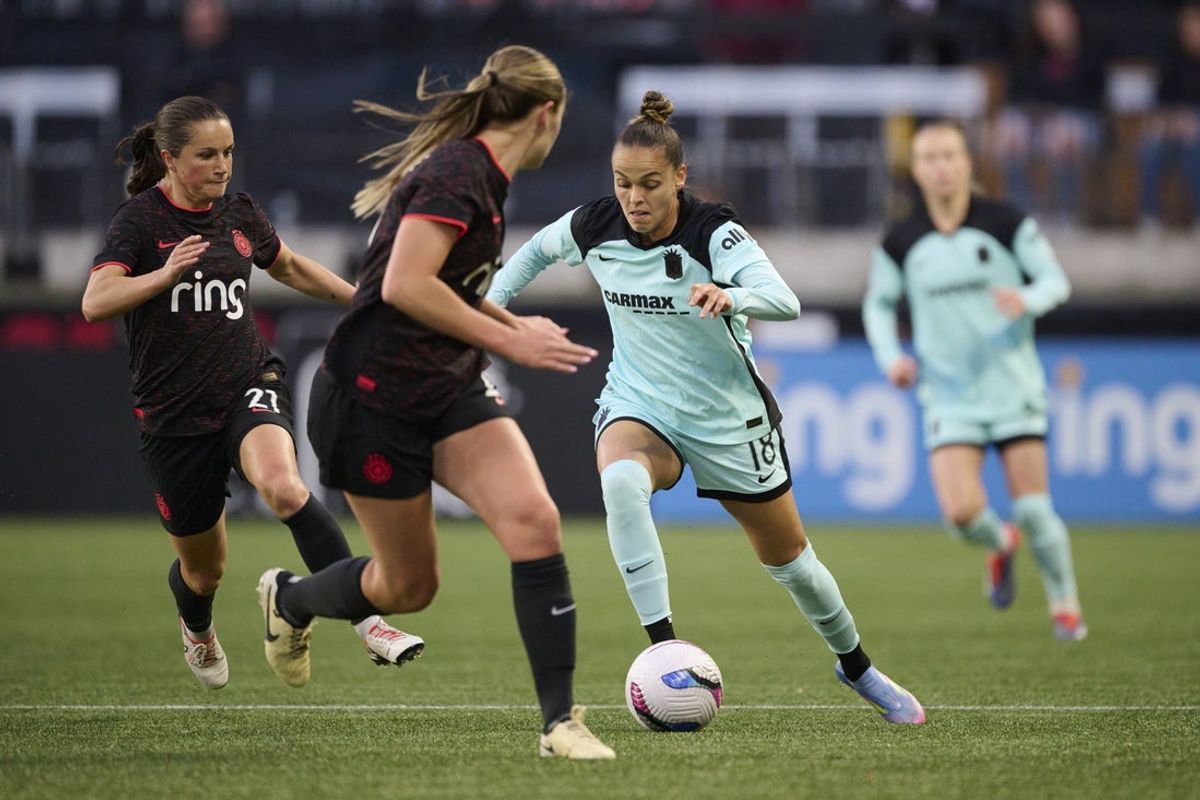 Apr 22, 2025; Portland, Oregon, USA; NJ/NY Gotham FC forward Gabi Portilho (18) controls a pass during the first half against Portland Thorns FC midfielder Jessie Fleming (21) at Providence Park. Mandatory Credit: Troy Wayrynen-Imagn Images