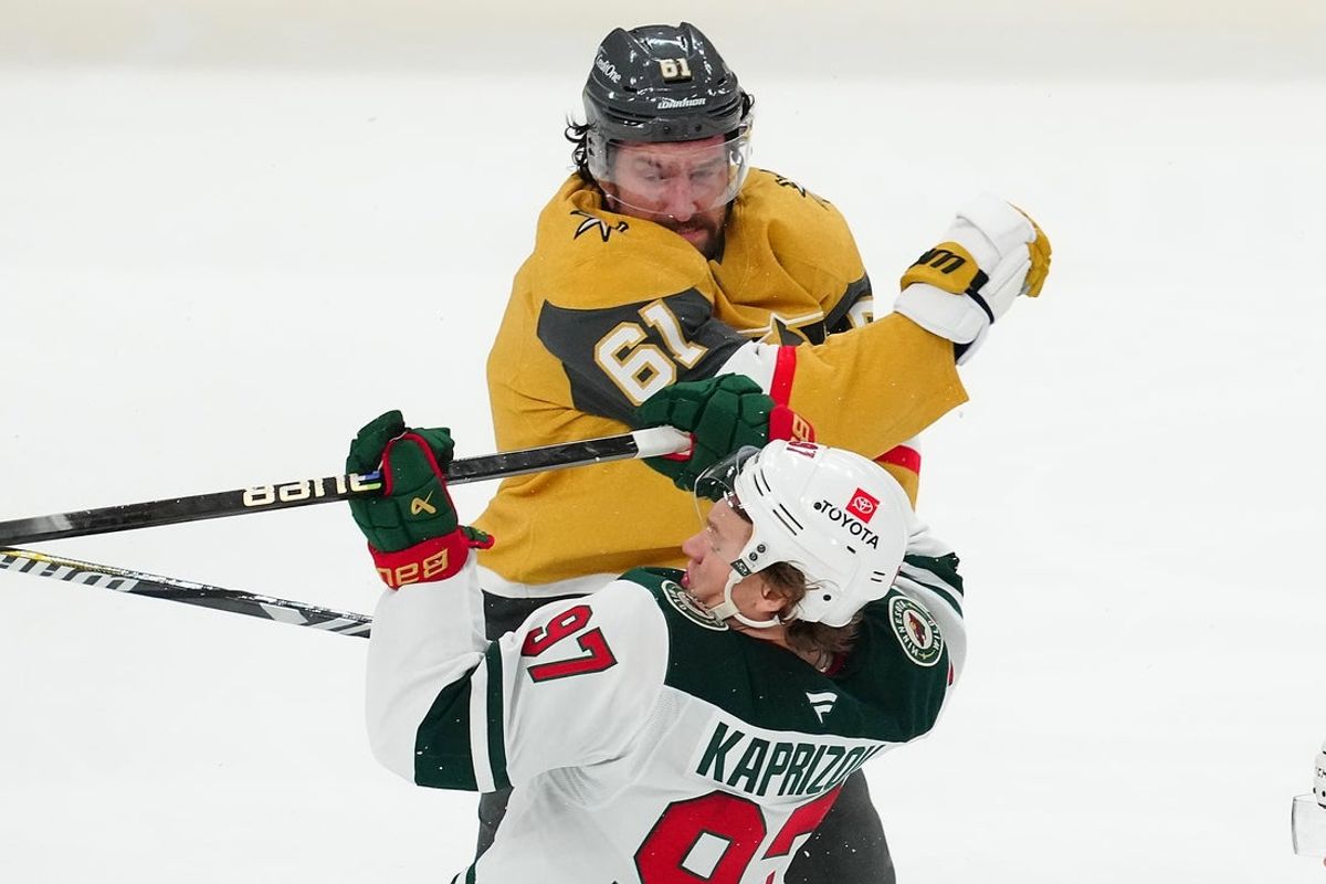 Apr 22, 2025; Las Vegas, Nevada, USA; Vegas Golden Knights right wing Mark Stone (61) checks Minnesota Wild left wing Kirill Kaprizov (97) during the third period of game two of the first round of the 2025 Stanley Cup Playoffs at T-Mobile Arena. Mandatory Credit: Stephen R. Sylvanie-Imagn Images