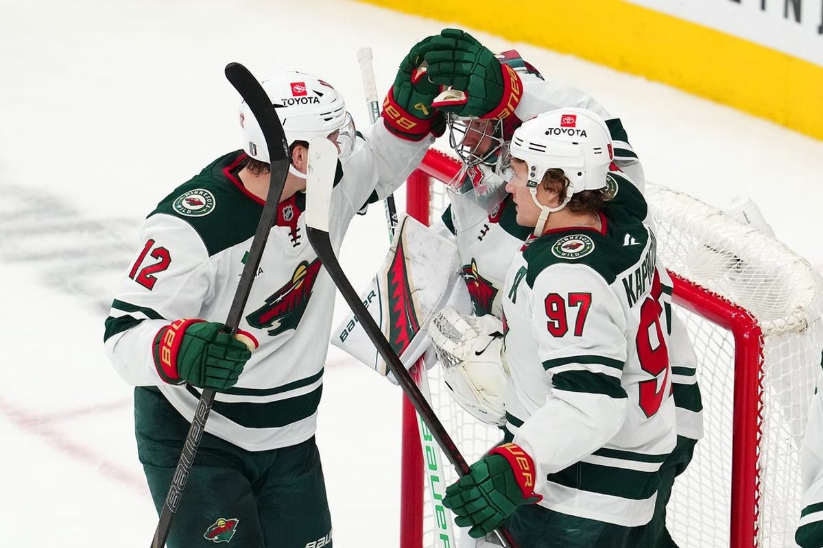 Apr 22, 2025; Las Vegas, Nevada, USA; Minnesota Wild left wing Matt Boldy (12) and Minnesota Wild left wing Kirill Kaprizov (97) congratulate Minnesota Wild goaltender Filip Gustavsson (32) after the Wild defeated the Vegas Golden Knights 5-2 in game two of the first round of the 2025 Stanley Cup Playoffs at T-Mobile Arena. Mandatory Credit: Stephen R. Sylvanie-Imagn Images