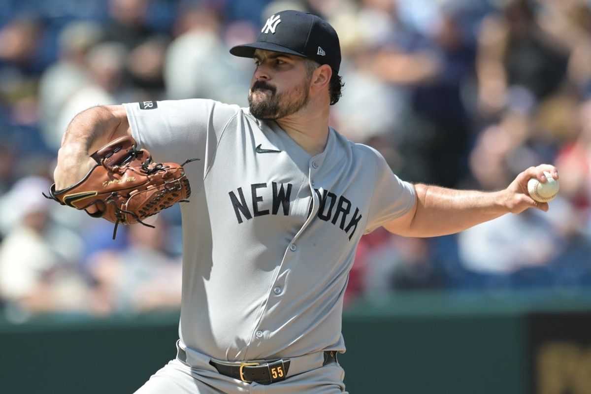 Apr 23, 2025; Cleveland, Ohio, USA; New York Yankees starting pitcher Carlos Rodon (55) throws a pitch during the first inning against the Cleveland Guardians at Progressive Field. Mandatory Credit: Ken Blaze-Imagn Images