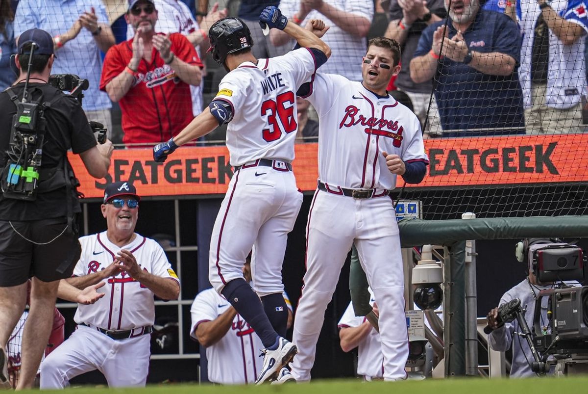 Apr 23, 2025; Cumberland, Georgia, USA; Atlanta Braves outfielder Eli White (36) reacts with third base Austin Riley (27) after hitting a three run home run against the St. Louis Cardinals during the eighth inning at Truist Park. Mandatory Credit: Dale Zanine-Imagn Images