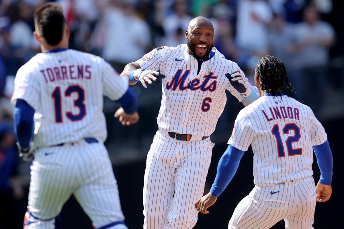 Apr 23, 2025; New York City, New York, USA; New York Mets designated hitter Starling Marte (6) celebrates his walkout RBI single against the Philadelphia Phillies with catcher Luis Torrens (13) and shortstop Francisco Lindor (12) during the tenth inning at Citi Field. Mandatory Credit: Brad Penner-Imagn Images
