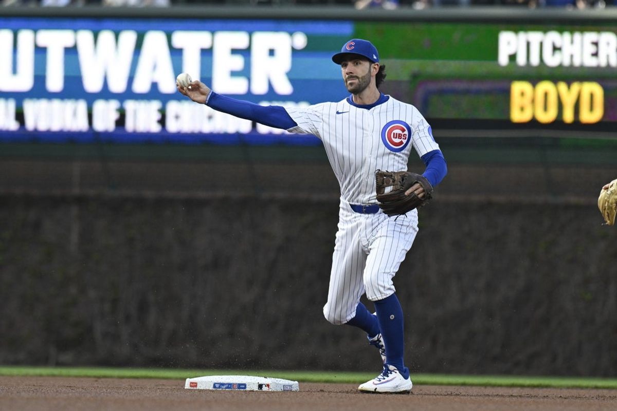 Apr 23, 2025; Chicago, Illinois, USA;  Chicago Cubs shortstop Dansby Swanson (7) completes a double play against the Los Angeles Dodgers during the first inning at Wrigley Field. Mandatory Credit: Matt Marton-Imagn Images