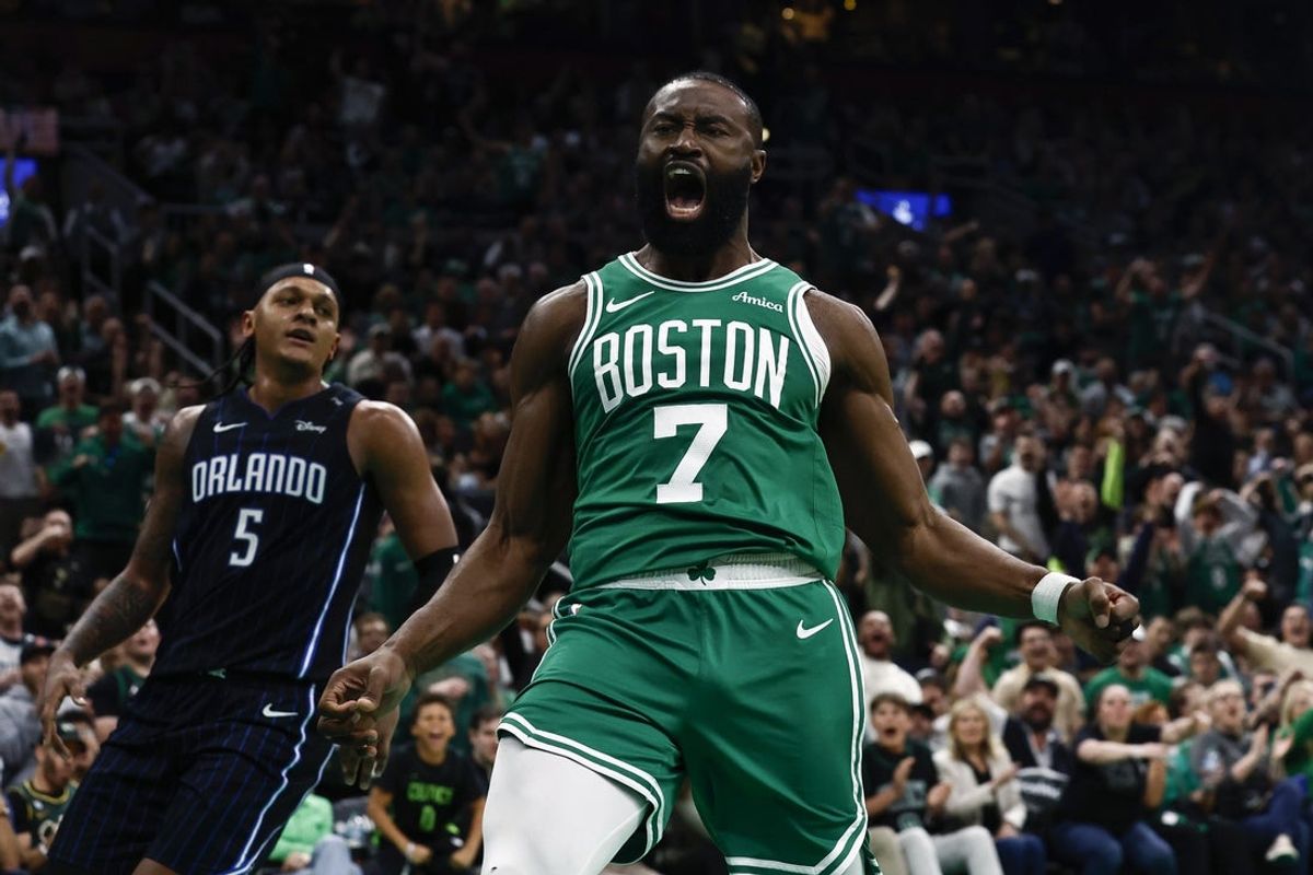 Apr 23, 2025; Boston, Massachusetts, USA; Boston Celtics guard Jaylen Brown (7) shouts out after dunking as Orlando Magic forward Paolo Banchero (5) turns away during the second half of game two of the first round of the 2024 NBA Playoffs at TD Garden. Mandatory Credit: Winslow Townson-Imagn Images