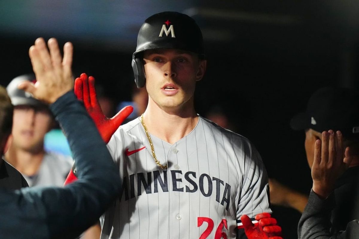 Sep 29, 2023; Denver, Colorado, USA; Minnesota Twins pinch runner Max Kepler (26) celebrates scoring a run in the ninth inning against the Colorado Rockies at Coors Field.